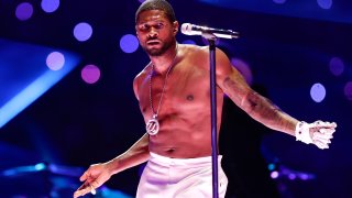 Usher performs during halftime of Super Bowl LVIII on Sunday