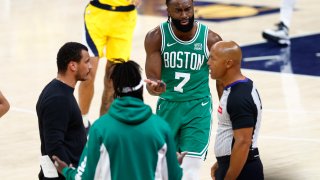 Indianapolis, IN – May 25: From left, Boston Celtics head coach Joe Mazzulla, guard Jrue Holiday and guard Jaylen Brown argue a call with referee Marc Davis in the first half of Game 3 of the 2024 Eastern Conference Finals. (Photo by Danielle Parhizkaran/The Boston Globe via Getty Images)