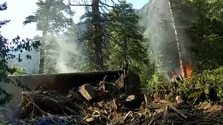 Truck in flames at a forest in Utah.