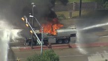 A tanker truck carrying 5,000 gallons of diesel fuel catches fire in DeSoto, Friday, June 7, 2024.