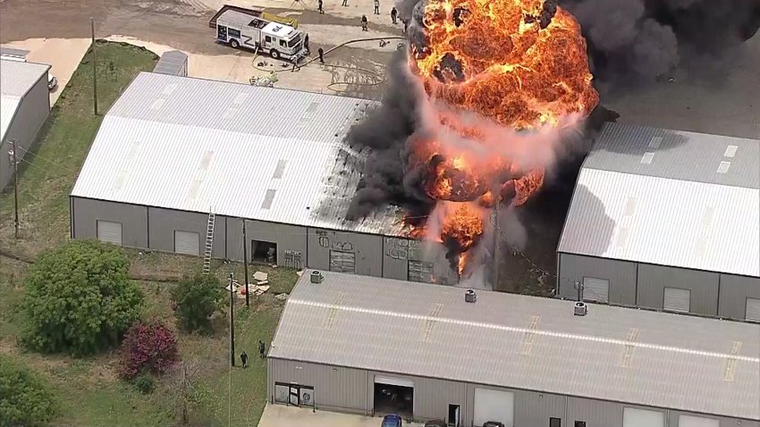 Firefighters battle an industrial fire in Johnson County, June 20, 2024.