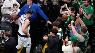 Dallas Mavericks guard Luka Doncic (77) heads to the locker room after a 105-98 loss to the Boston Celtics following Game 2 of the NBA Finals basketball series, Sunday, June 9, 2024, in Boston. (AP Photo/Michael Dwyer)