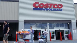 Customers exit a Costco store in Teterboro, New Jersey, on June 28, 2023.