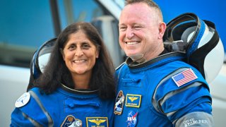 NASA astronauts Butch Wilmore (R) and Suni Williams, wearing Boeing spacesuits, depart the Neil A. Armstrong Operations and Checkout Building at Kennedy Space Center for Launch Complex 41 at Cape Canaveral Space Force Station in Florida to board the Boeing CST-100 Starliner spacecraft for the Crew Flight Test launch, on June 5, 2024.