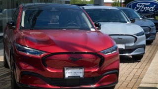 Ford Mustang Mach E electric vehicles are offered for sale at a dealership in Chicago, Illinois, on June 5, 2024.