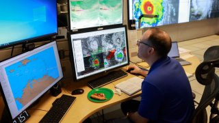 Brad Reinhart, Senior Hurricane Specialist at the National Hurricane Center, works on tracking Hurricane Beryl, the first hurricane of the 2024 season, at the National Hurricane Center on July 01, 2024 in Miami, Florida. 