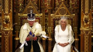 King Charles III, wearing the Imperial State Crown and the Robe of State reads the King’s Speech from the The Sovereign’s Throne next to Queen Camilla, wearing the George IV State Diadem in the House of Lords chamber, in the Houses of Parliament on July 17, 2024 in London, England. 