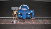 Kyle Larson kisses the bricks