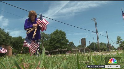 Volunteers in Irving plant flags for Fourth of July