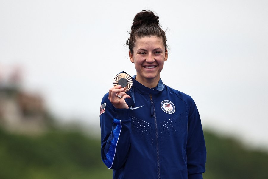 US' Chloe Dygert celebrates with her bronze medal on the podium