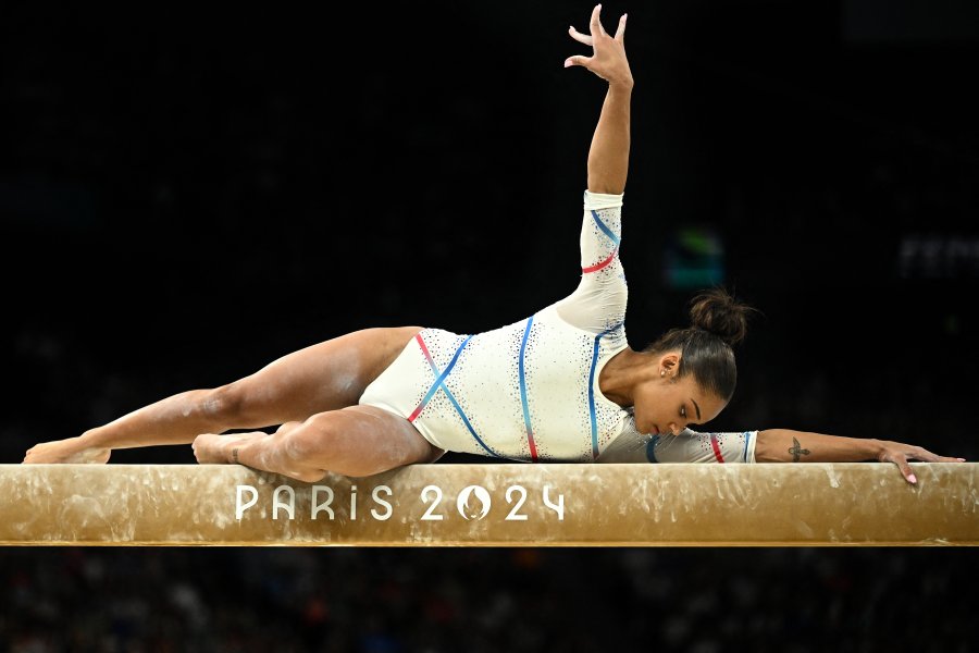 France's Melanie De Jesus Dos Santos competes in the balance beam event