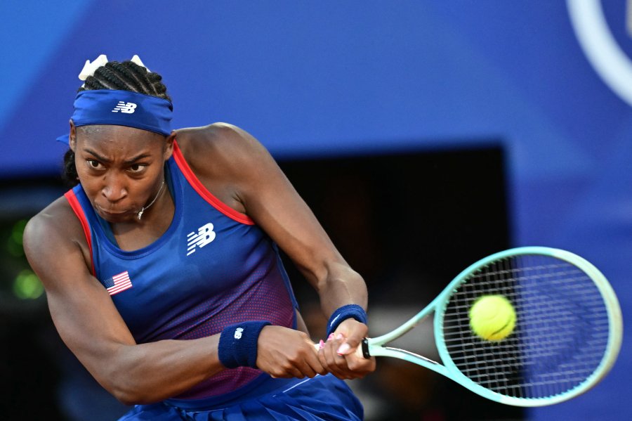 US' Coco Gauff returns to Australia's Ajla Tomljanovic during their women's singles first round tennis match on Court Philippe-Chatrier at the Roland-Garros Stadium at the Paris 2024 Olympic Games.