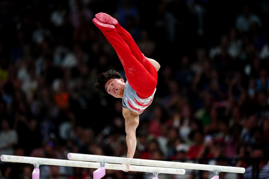 US's Asher Hong performs on the Parallel Bars during the Men's Team Final at Bercy Arena, on the third day of the 2024 Paris Olympic Games in France.