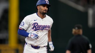Texas Rangers’ Marcus Semien rounds the bases after hitting a two-run home run against the Tampa Bay Rays in the seventh inning of a baseball game in Arlington, Texas, Saturday, July 6, 2024. (AP Photo/Tony Gutierrez)
