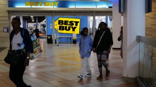 People walk into a Best Buy store in a Brooklyn mall on August 29, 2023 in New York City.