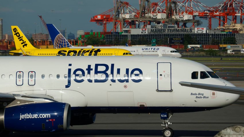 JetBlue Airways, Spirit Airlines and United Airlines airplanes proceed to gates after landing at Newark Liberty International Airport in Newark, New Jersey on May 30, 2024.