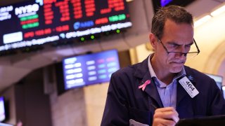 Traders work on the floor of the New York Stock Exchange during afternoon trading on August 02, 2024 in New York City. 