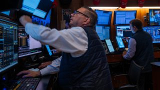 Traders work on the New York Stock Exchange floor on Aug. 8, 2024.