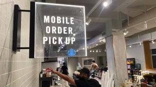 Mobile order and Uber Eats and Doordash delivery pick up area at Starbucks coffee shop, Queens, New York. 