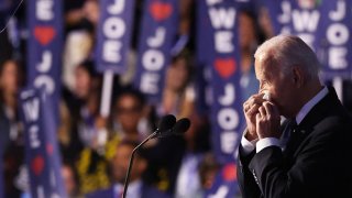 U.S. President Joe Biden blows his nose during Day one of the Democratic National Convention (DNC) in Chicago, Illinois, U.S., August 19, 2024. 