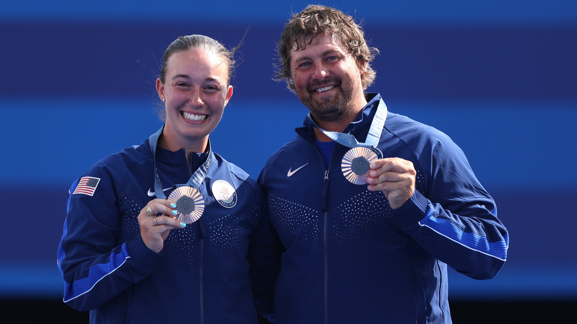 Team USA's Casey Kaufhold and Brady Ellison pose with bronze medals