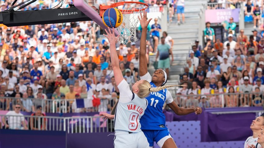 Hailey van Lith (9), of the United States, drives past Myriam Djekoundade (11), of France, in the women’s 3×3 basketball pool round match during the 2024 Summer Olympics, Friday, Aug. 2, 2024, in Paris, France. The United States won 14-13.