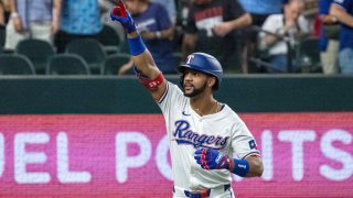 Texas Rangers’ Leody Taveras celebrates his solo home run off of Boston Red Sox starting pitcher Tanner Houck during the fourth inning of a baseball game, Saturday, Aug. 3, 2024, in Arlington, Texas. (AP Photo/Jeffrey McWhorter)