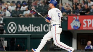 Texas Rangers’ Corey Seager watches his solo home run that came off a pitch from Pittsburgh Pirates starter Luis Ortiz in the first inning of a baseball game, Monday, Aug. 19, 2024, in Arlington, Texas.