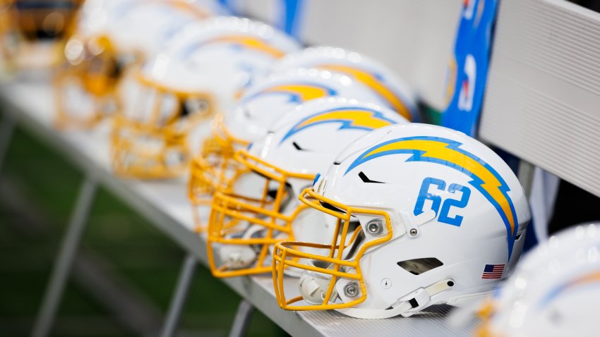 INGLEWOOD, CALIFORNIA – AUGUST 12: Helmets of the Los Angeles Chargers on the sideline during a game against the Los Angeles Rams at SoFi Stadium on August 12, 2023 in Inglewood, California. (Photo by Ric Tapia/Getty Images)