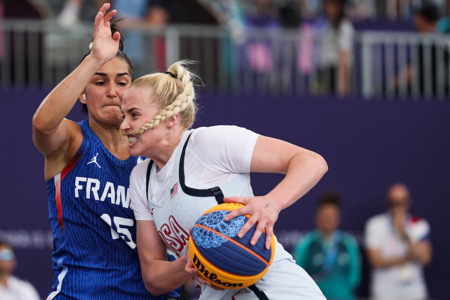 France's Hortense Limouzin fights for the ball with US' Hailey van Lith