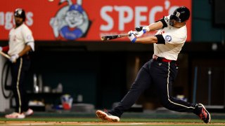 ARLINGTON, TX – AUGUST 02: Corey Seager #5 of the Texas Rangers hits a solo home run against the Boston Red Sox during the first inning at Globe Life Field on August 2, 2024 in Arlington, Texas.