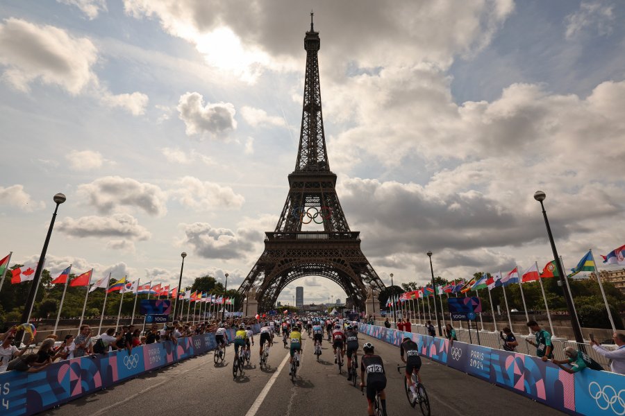 Riders at the foot of the Eiffel Tower at the start of the men's cycling road rac