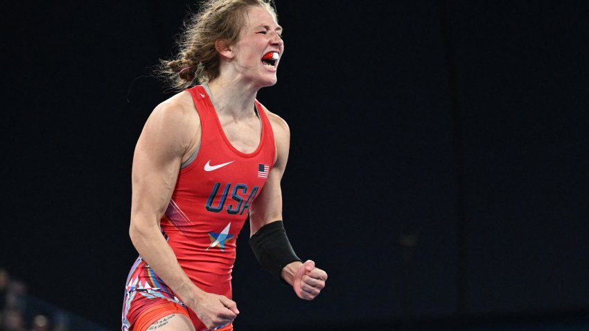 US’ Sarah Ann Hildebrandt reacts to her win over Mongolia’s Otgonjargal Dolgorjav in their women’s freestyle 50kg wrestling semi-final match at the Champ-de-Mars Arena during the Paris 2024 Olympic Games, in Paris on August 6, 2024. (Photo by PUNIT PARANJPE/AFP via Getty Images)