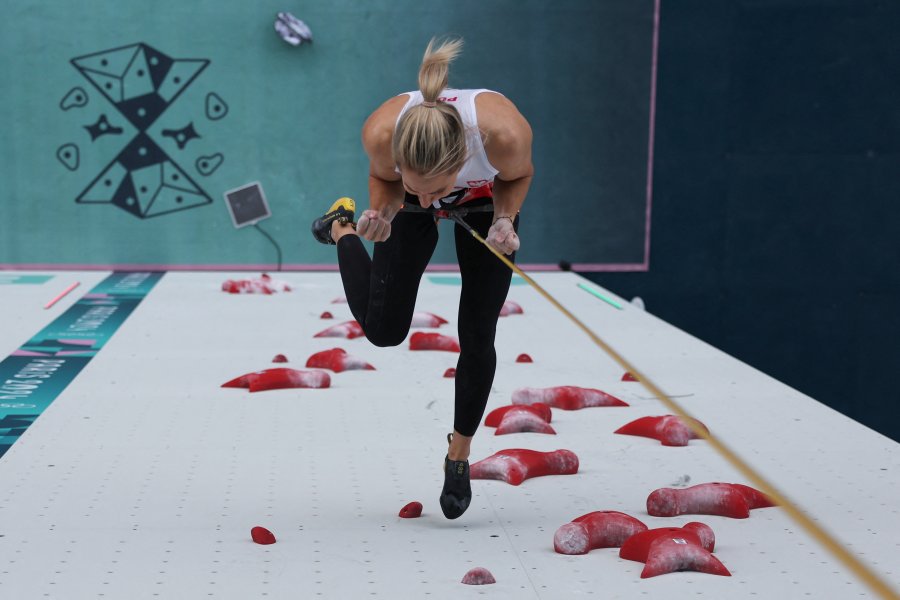 An overview shows Poland's Aleksandra Miroslaw celebrates after winning the women's sport climbing speed final during the Paris 2024 Olympic Games at Le Bourget Sport Climbing Venue in Le Bourget on August 7, 2024