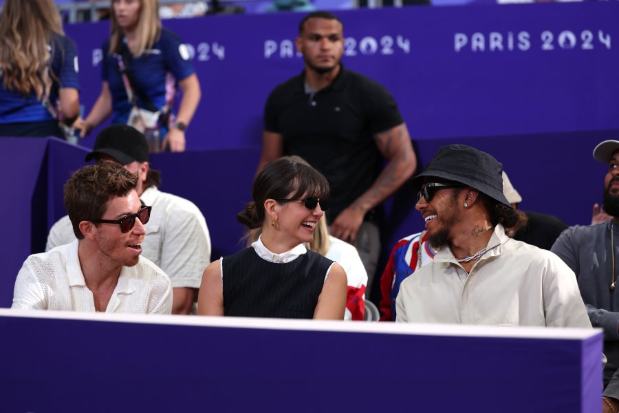 Shaun White, Nina Dobrev and Lewis Hamilton sitting together