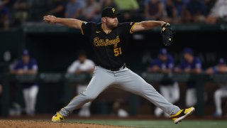 ARLINGTON, TX – AUGUST 20: David Bednar #51 of the. Pittsburgh Pirates pitches during the game between the Pittsburgh Pirates and the Texas Rangers at Globe Life Field on Tuesday, August 20, 2024 in Arlington, Texas.