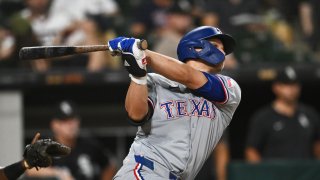 CHICAGO, ILLINOIS – AUGUST 28: Corey Seager #5 of the Texas Rangers hits an RBI single in the ninth inning against the Chicago White Sox during game two of a doubleheader at Guaranteed Rate Field on August 28, 2024 in Chicago, Illinois.