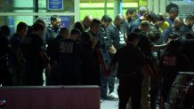 Police officers gathered outside Methodist Dallas Medical Center.