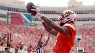 Oklahoma State’s Ollie Gordon II (0) celebrates his touchdown in the second half of the college football game between the Oklahoma State Cowboys and South Dakota State Jackrabbits at Boone Pickens Stadium in Stillwater, Okla., Saturday, Aug., 31, 2024. (SARAH PHIPPS/THE OKLAHOMAN / USA TODAY NETWORK)