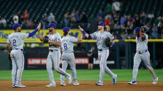 Aug 28, 2024; Chicago, Illinois, USA; Texas Rangers players celebrate after defeating the Chicago White Sox in game two of the doubleheader at Guaranteed Rate Field. Mandatory Credit: Kamil Krzaczynski-USA TODAY Sports