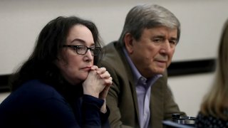 Rose Marie Kosmetatos, left, and her husband, Antonios Pagourtzis, parents of accused Santa Fe High School shooter Dimitrios Pagourtzis, listen to their attorneys discuss a motion Friday, Aug. 16, 2024, during their civil trial in Galveston County Court No. 3 Judge Jack Ewing’s courtroom at the Galveston County Courthouse in Galveston, Texas.  (Jennifer Reynolds/The Galveston County Daily News via AP, Pool)