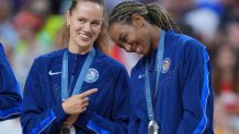  United States outside hitter Kelsey Robinson (23) and United States middle blocker Chiaka Ogbogu (24) receive their silver medals after the women's volleyball gold medal match during the Paris 2024 Olympic Summer Games at South Paris Arena. Mandatory Credit: Amber Searls-USA TODAY Sports