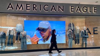 A shopper walks by an American Eagle store on November 21, 2023 in Glendale, California. 