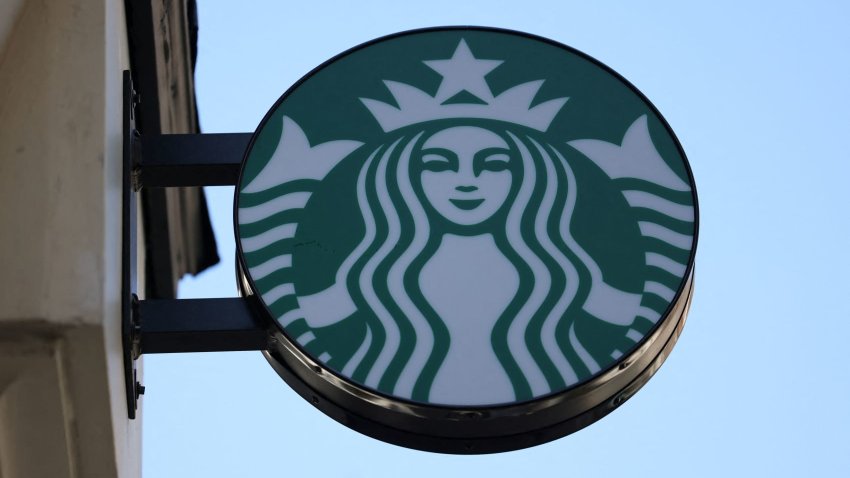 The Starbucks logo is displayed above one of its cafes in London on Aug. 13, 2024.
