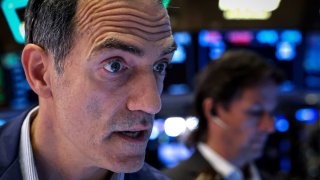 Traders work on the floor at the New York Stock Exchange (NYSE) in New York City, U.S., September 4, 2024. 