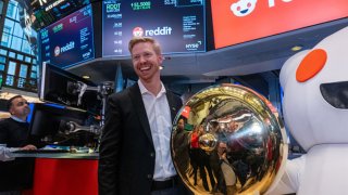 Reddit CEO Steve Huffman stands on the floor of the New York Stock Exchange (NYSE) after ringing a bell on the floor setting the share price at $47 in its initial public offering (IPO) on March 21, 2024 in New York City.