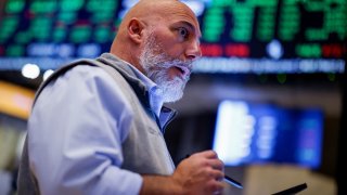 Traders work on the floor at the New York Stock Exchange on Sept. 9, 2024.