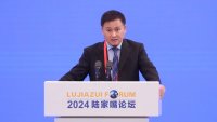 Pan Gongsheng, governor of the People’s Bank of China, delivers a speech during the 2024 Lujiazui Forum on June 19, 2024 in Shanghai, China.