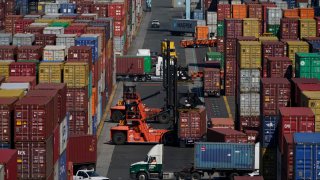 Containers are moved at the Port of New York and New Jersey in Elizabeth, N.J., on June 30, 2021.