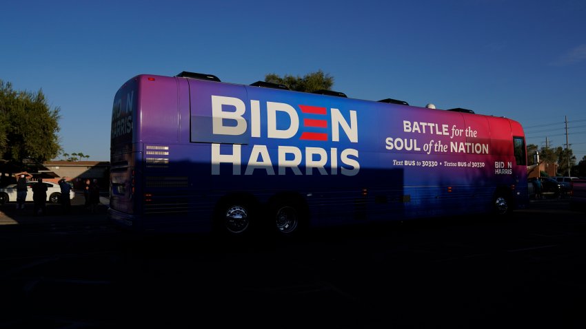 Democratic presidential candidate former Vice President Joe Biden and Democratic vice presidential candidate Sen. Kamala Harris, D-Calif., ride on a bus in Phoenix, Oct. 8, 2020, on a small business bus tour. (AP Photo/Carolyn Kaster, File)